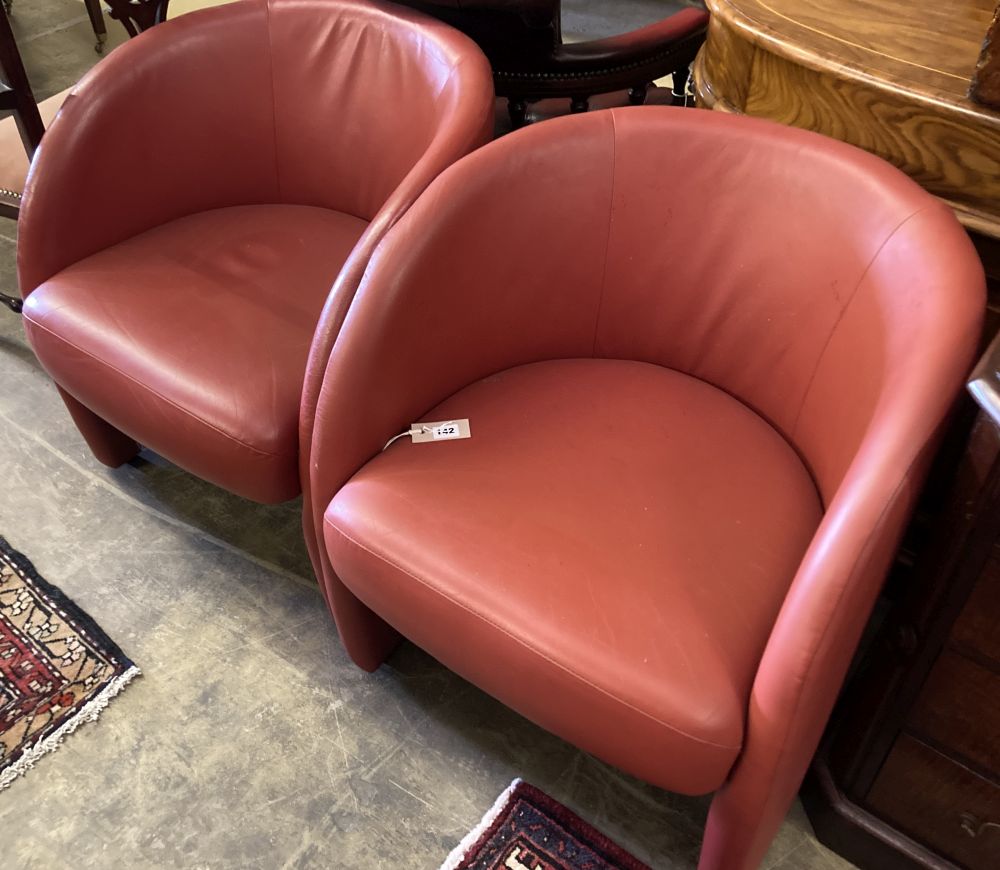 A pair of Italian design red leather tub chairs, c. 1980, width 60cm